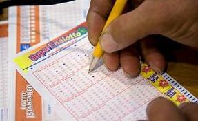superenalotto lotto lottery player chooses his lucky numbers